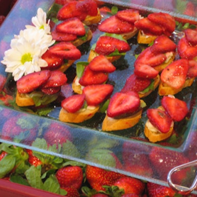 Ginger Island Cuisine served strawberry bruschetta on clear glass platters over a bed of strawberries.