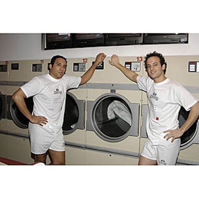 A pair of models from T&L Events stripped down to demonstrate Bagir's new line of wash-and-dry suits for JCPenney.