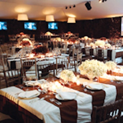 Monn created a chic look for the Guggenheim Museum's International gala, using a brown and white palette inside a white tent on the plaza of the Seagram Building. He covered long rectangular tables and banquet rounds with custom-made table linens of white silk taffeta sewn with wide strips of brown. Chocolate brown southern oak hedges surrounded the tent's walls and columns.
