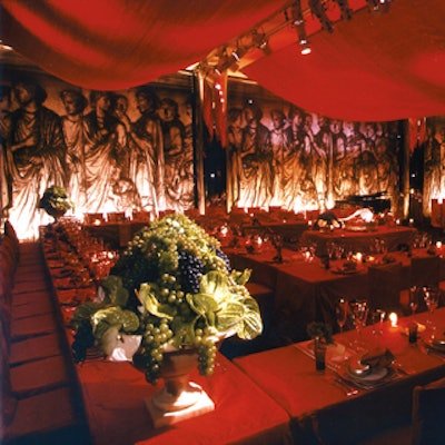 Carmona Design and Events filled the Kaplan Penthouse at Lincoln Center with Roman references for an October dinner and concert. Rich cardinal-red dupioni silk covered the tables, and lavish silver pedestals held persimmons, pomegranates, and taxidermy pheasants. A floor-to-ceiling scrim printed with reproductions of the Ara pacis relief sculptures in Rome masked windows.