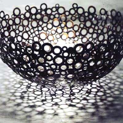 This sturdy bowl made from different sizes of brass washers has an industrial, lacy look, and comes in seven, 18-, and 20-inch diameters. Available from Props for Today.