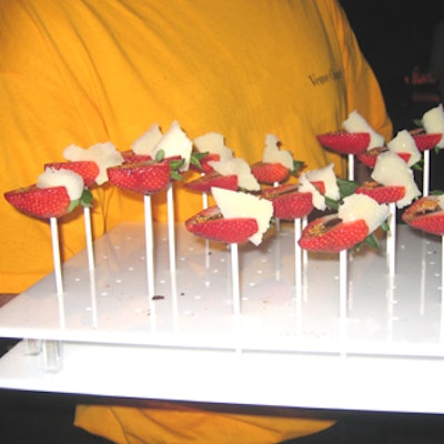 The catering staff of the Hotel Victor passed portable bites on lollipop sticks, including strawberries with balsamic vinaigrette and slivers of parmesan.