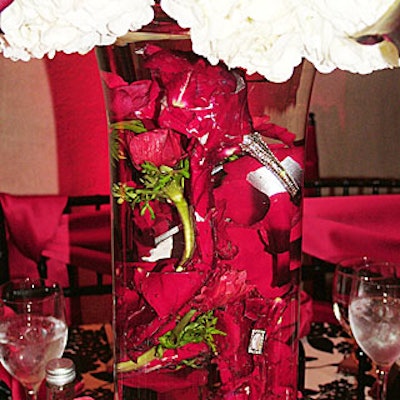 On the tabletops, rhinestone-encrusted, petal-covered shoes filled glass cylindrical vases.