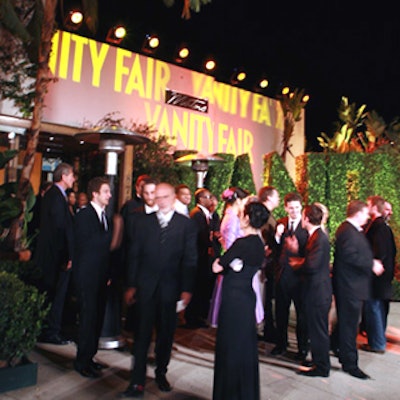Vanity Fair announced its Oscar bash—to anyone who hadn't heard—with its name constructed out of 30-foot high myrtle topiary lettering and projected in lights on the front of Morton's.