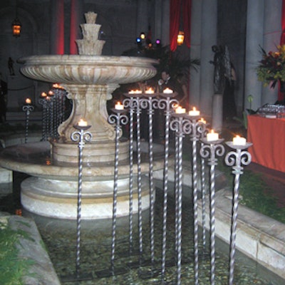 Cathedral candles lit up the fountain in the Frick's Garden Court.