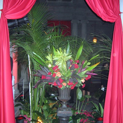 Galen Lee decorated the museum with crimson fabric and urns overflowing with tropical foliage.