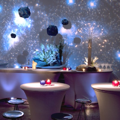 Cocktails, along with a variety of other beverages provided by Abigail Kirsch, were served under hanging comets and a backdrop of projected stars at the Moon-theme bar.