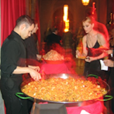 Back in New York at the Frick's benefit, caterer Mary Giuliani served paella from a giant wok-shaped dish.