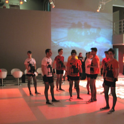 Stylist Sam Spector dressed Eye5's staff in tight black shorts and fishnet stockings.