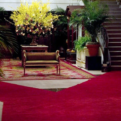 Flowers—huge, classic arrangements of forsythia, roses, lilies, and camellias in shades of yellow, red, orange, and pink—decorated the atrium.