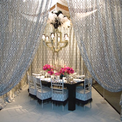 The lavish royal pavilion at Brighton, England, served as inspiration to the partners at Philip Gorrivan Design. Various black, white, and silver elements were used, including a 1970's chandelier that echoed the 18th-century Moorish fretwork pattern in the fabric that draped the entry to the dining space. The fabric covered the table and chairs, and a whimsical touch was the inclusion of ostrich trim on chair cushions and an infusion of colorful flowers on the tabletop.