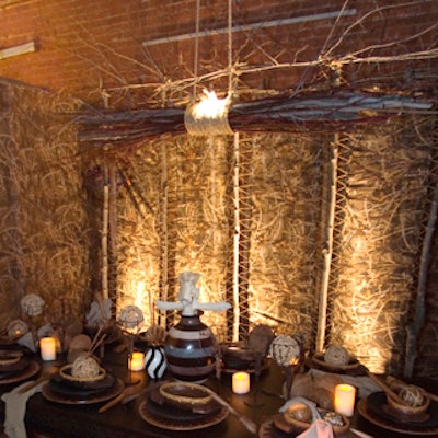 Peggy Bellar Catering & Event Planning used natural materials to achieve a primitive, African-inspired style. Bellar bolted together branches of maple and red twig dogwood taken from her backyard in upstate New York, bound them with hemp, and hung them from the ceiling.