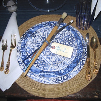 Inspired by the French Riviera and the artists who made their home there, the details at the setting for Ralph Lauren Home included bundles of paint brushes tied with tags that served as name cards at each place setting.