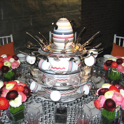 Gary Warren, the visual director of Missoni USA, designed a centerpiece using Missoni Home plates, flatware, and teapot which were stacked and glued together. Even the small floral arrangements had a touch of the design brand—they were tied with Missoni ribbon.