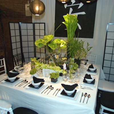 Richard Simms for Wildflowers used his years in Japan to create a serene table with an Asian feel. The simple black-and-white look included white screens with black frames circling the table, a hand-painted tablecloth decorated with a Chinese character in each of the four corners of the table, and Simms' hand-painted poster of the Chinese character for peace, tranquility, and quiet.