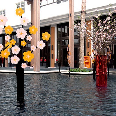 JMVisuals placed its pink and yellow metal cutout trees in the reflecting pools of Miami's Setai hotel.