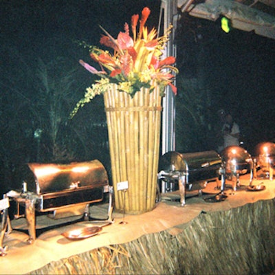 The buffet stations were decorated with natural thatched skirting and tropical flowers.