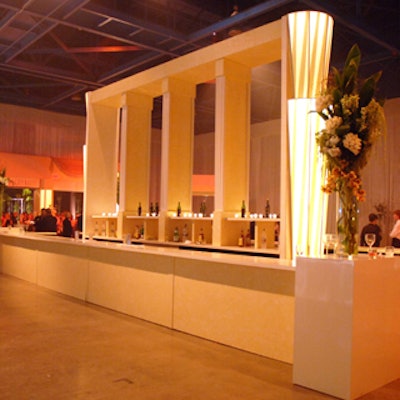 The cocktail reception had a retro glam feel to it with the help of this oversized cream-colored bar.