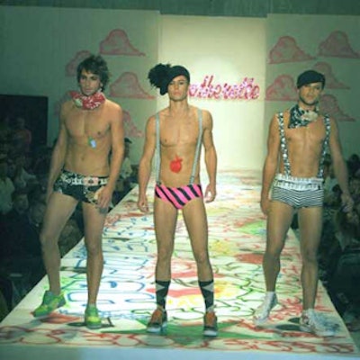 Heatherette sent a trio of models in colorful and skimpy fashions down the graffiti-lined runway.