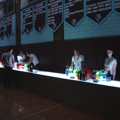 T&L Events caterwaiters dressed in Varvatos and New York Dolls cobranded T-shirts and served drinks from an underlit bar.