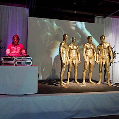 Gold-covered men posed near the DJ booth.