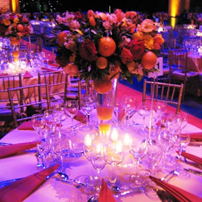 Simple floral centerpieces of oranges, lemons, tulips, stock, roses, Hypericum berries, starfish, and poppies sat atop each table.