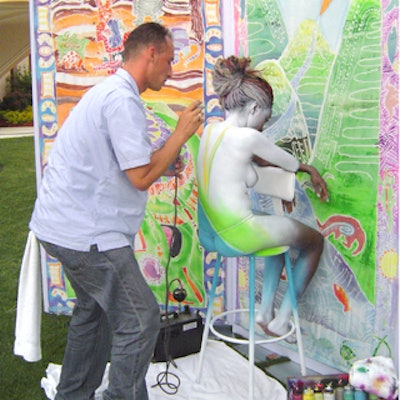 During cocktails, guests watched as an airbrush artist worked on a model.