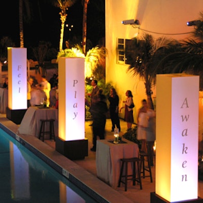 Gold columns set up along the pool represented the property's four-pillar philosophy of Play, Learn, Feel, and Awaken.