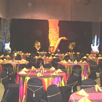Oversized jazz instruments and jewel-toned tables gave Art of the Party's warehouse a supper club feel for a Harlem Renaissance-themed event.