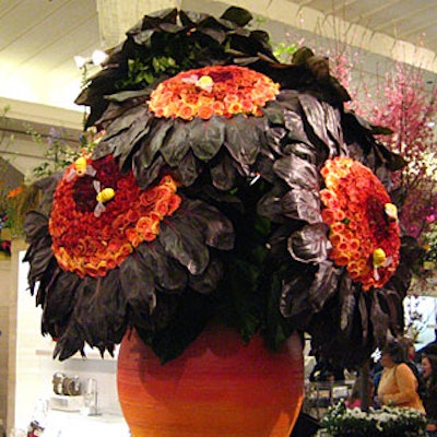 Jorge Cazzorla of Celebrate Flowers used hundreds of roses and rows of large, dark leaves for the arrangement of seven enormous sunflowers in the first 'Bouquet of the Day' at this year's flower show at Macy's.