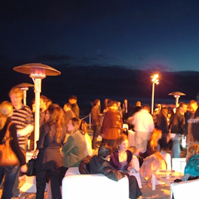 Royal Events provided all-white slipcovered seating on the beach.