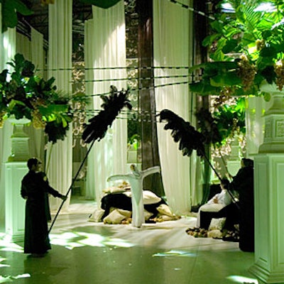 At the New Jersey Symphony Orchestra's Symphony Palace ball at Teterboro Airport, giant white urns on tall pedestals decorated the reception area. Staffers dressed in black cloaks fanned the area with giant ostrich feathers as a dancer attired in traditional Muslim bridal dress performed a modern dance to Middle Eastern house music. (The scene mimicked the prologue to 1,001 Arabian Nights, in which Scheherazade dances for the king.)