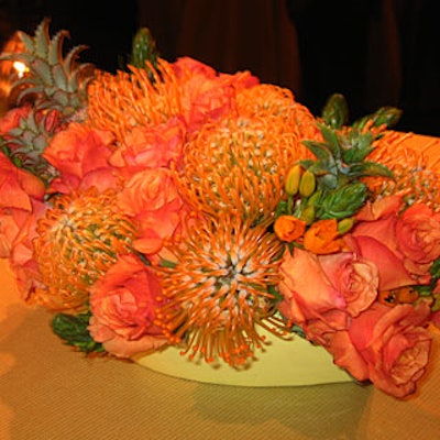 Citrus-colored flower arrangements decorated the cocktail and banquet tables.