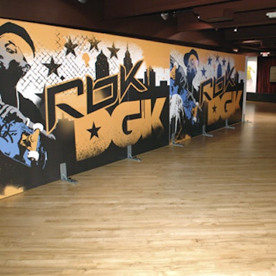 Graffiti-inspired signage on the wall marked the entrance to the venue.