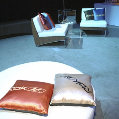 Seating featured satin throw pillows, and glass display cases studded the floor.