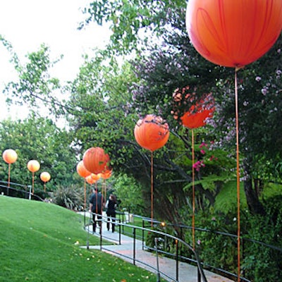 Guests entered Travel & Leisure’s 35th birthday party at the W Hotel—Westwood on a path lined with giant orange balloons.