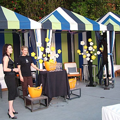 Staffers poured Veuve Clicquot from a cabana decorated with graphic, orange-toned faux flowers that matched the brand’s packaging.