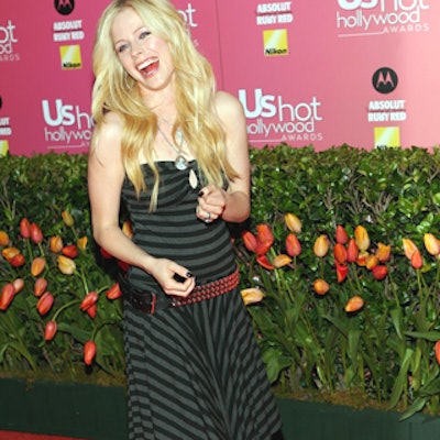 Rocker Avril Lavigne walked a pinkish red carpet decked with tulips to announce sponsor Absolut’s new flavor.