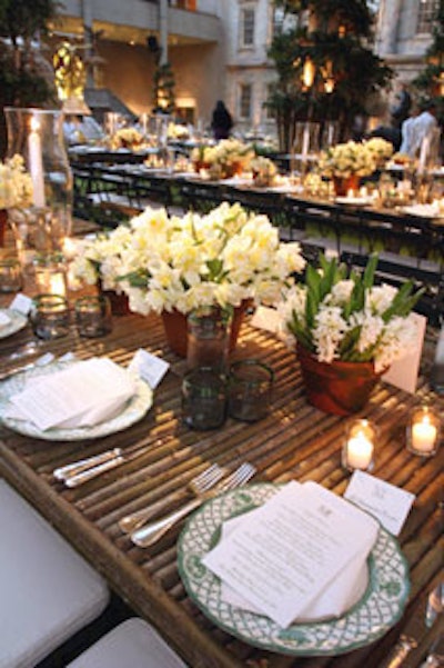 Each of the dinner tables featured three all-white centerpieces, one with daffodils, one with hyacinths, and one with narcissus, which were accentuated by English garden china by Spode, supplied by Party Rentals.