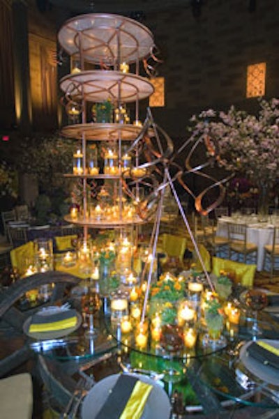 Susan Edgar's tabletop had a myriad of objects for guests to investigate. Marigolds were used throughout-from a patch of flowers underneath one the designer's three tables, to little pots that dotted the entire dining area. The colors of marigolds-yellow and orange-extended from linens to the stemware.