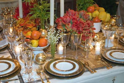 Lewis Miller of LMD Floral Events Interiors created an elegant garden setting. Bordered on four corners by monumental topiary obelisks, the designer's tabletop had a gold and white look with bursts of color in the form of flowers and fruit (with gilded fruit added into the mix).