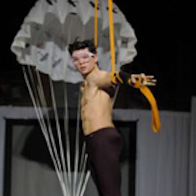 An aerialist from Zero Gravity Circus portrayed a paratrooper during Andrew Majtenyi's fall/winter fashion show at the Design Exchange.