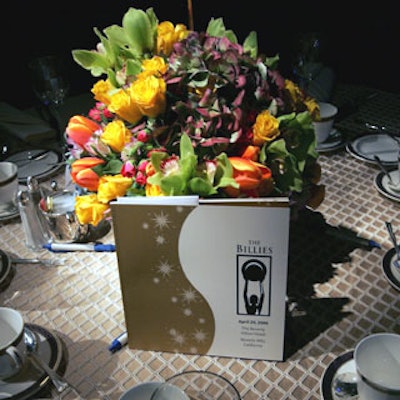 Tabletops featured colorful centerpieces from Flaming Flowers.