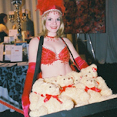 Scantily clad showgirls from K&M Productions raised funds through the sale of teddy bears.