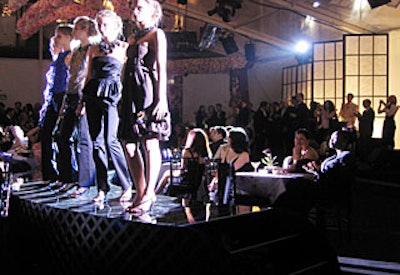 Models showed off the new collection from a black lacquer runway that snaked through the center of the room.