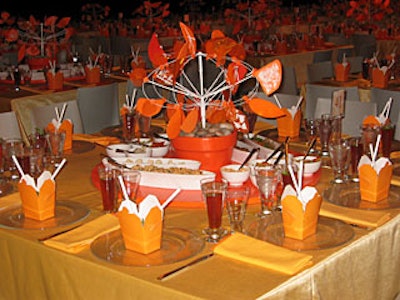 Taste Caterers placed Chinese takeout cartons containing cold sesame noodles at each place setting. Guests could add grilled meat, chicken, fish, or tofu, as well as chopped peanuts, fresh coriander, toasted coconut, bean sprouts, spring vegetables, and Asian vegetable slaw.