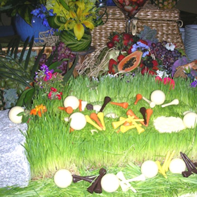 Wheat grass vignettes were dotted with chocolate golf tees in orange, brown, and white and white chocolate golf balls.