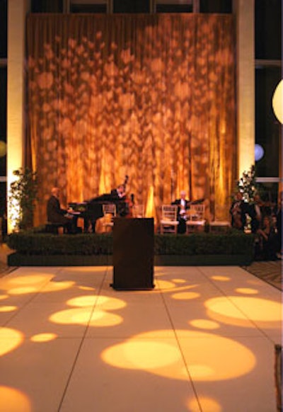 Images by Lighting projected slow-moving bubble gobos on an amber curtain behind the band while guests danced.