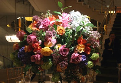 Mark's Garden's colorful centerpieces featured hydrangea, tulips, hyacinth, Lady Slipper orchids, and pink, yellow, and burnt orange roses.