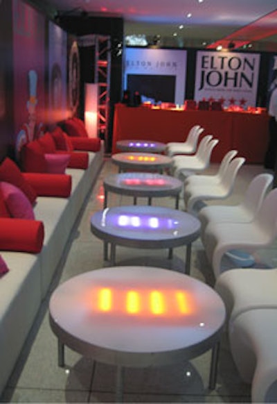 White banquettes and translucent tables illuminated from within added to the colorful and electric vibe.